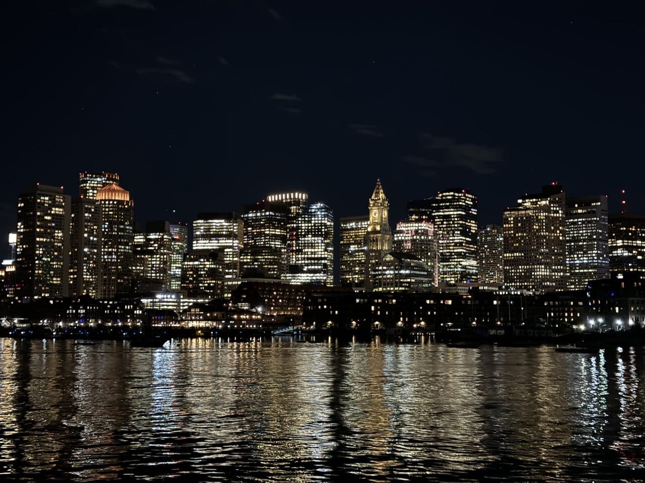 Night view of the Boston skyline from the boat during the Bio-IT Harbor Cruise Networking Event.